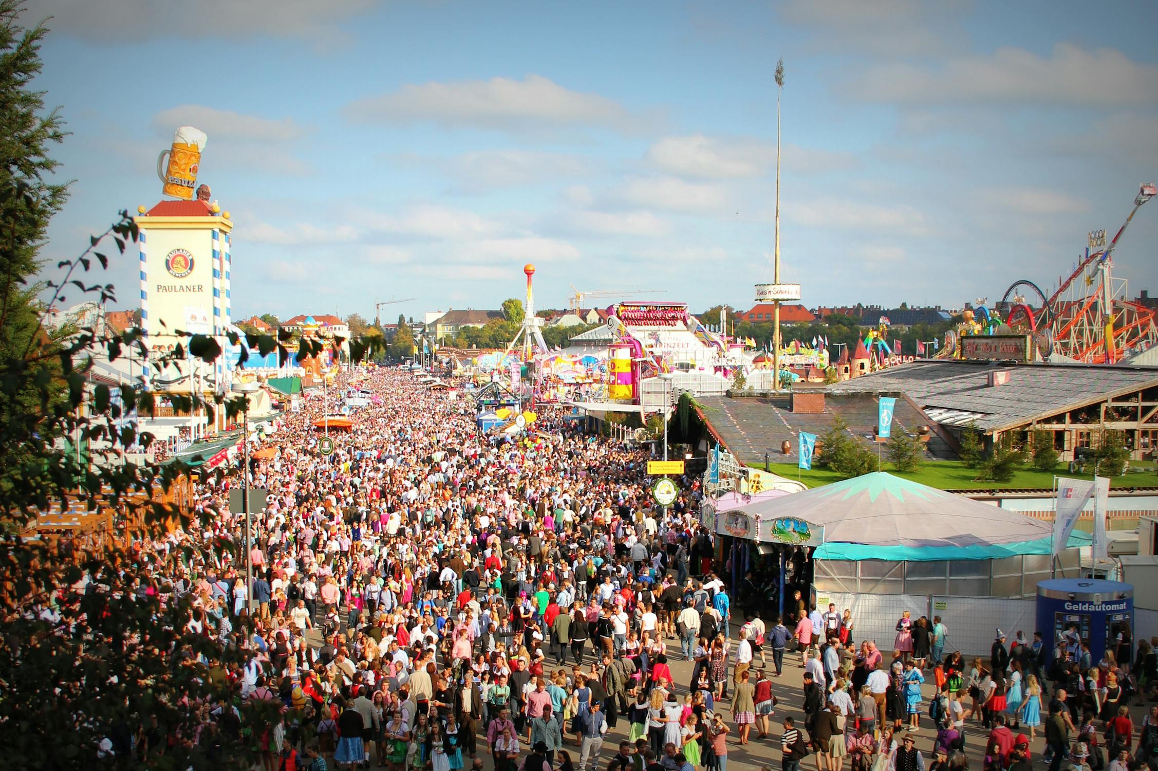 Massive crowd enjoying Oktoberfest festivities and attractions in Munich
