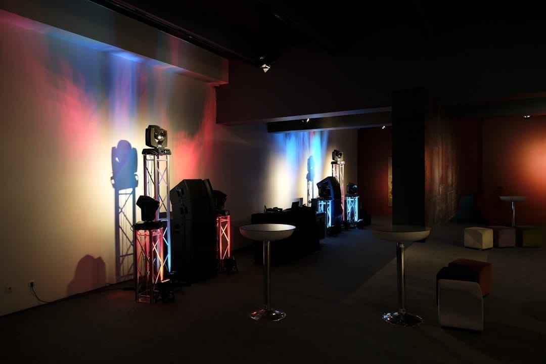 Professional event setup inside aircraft hangar with elegant lighting and decor