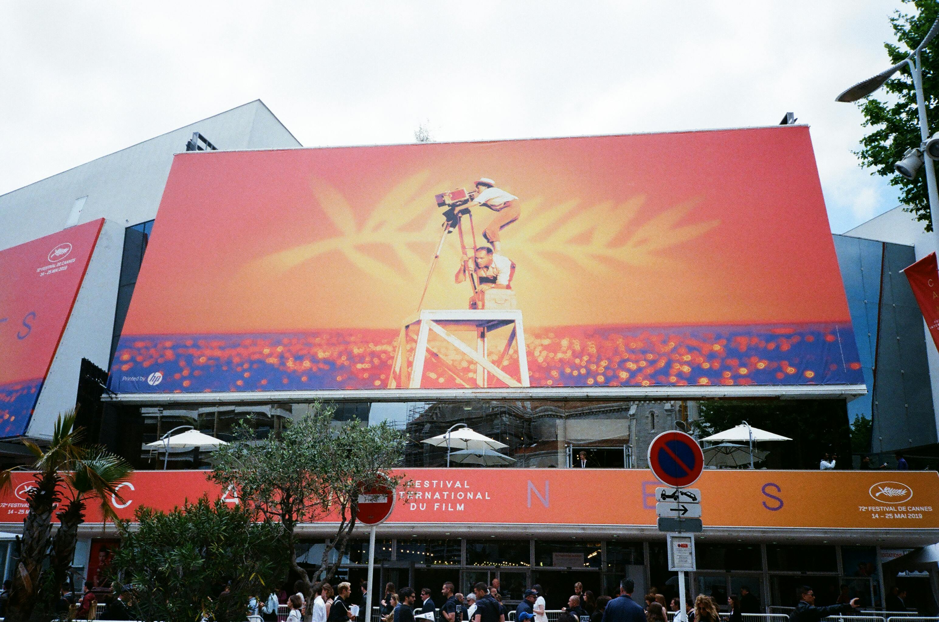Cannes Film Festival billboard with vibrant imagery