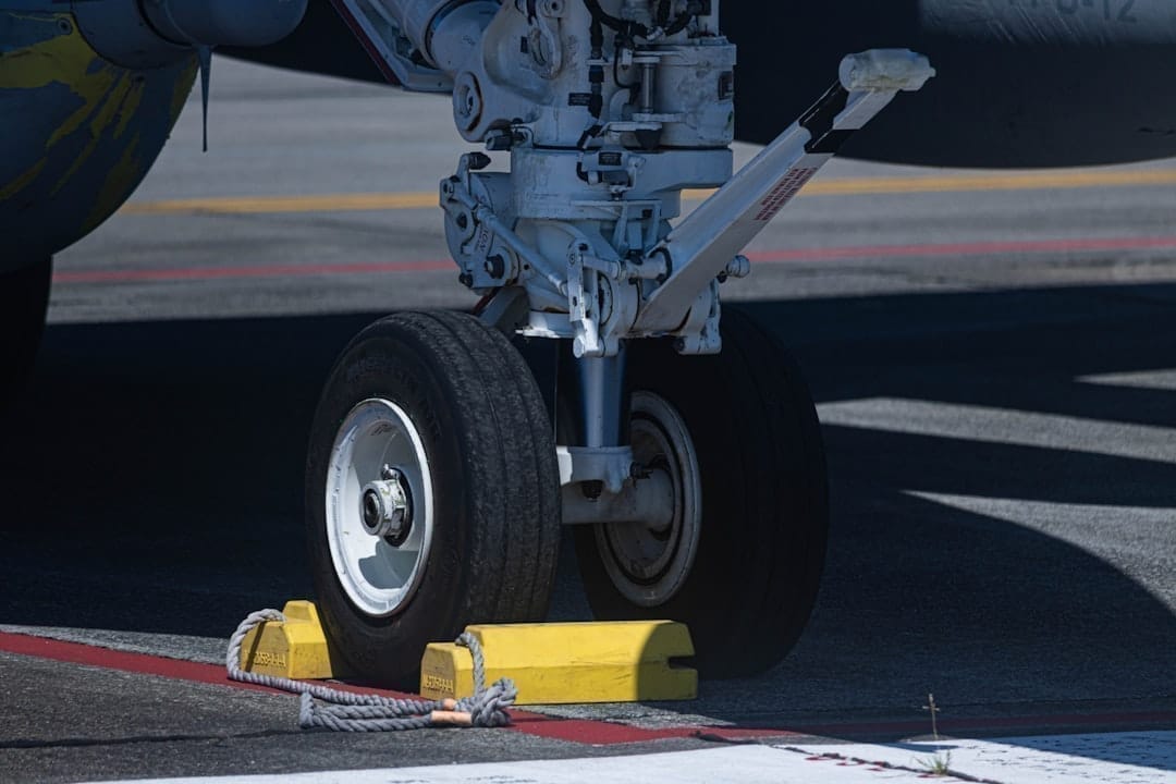 Aircraft positioned on FBO ramp with ground support equipment