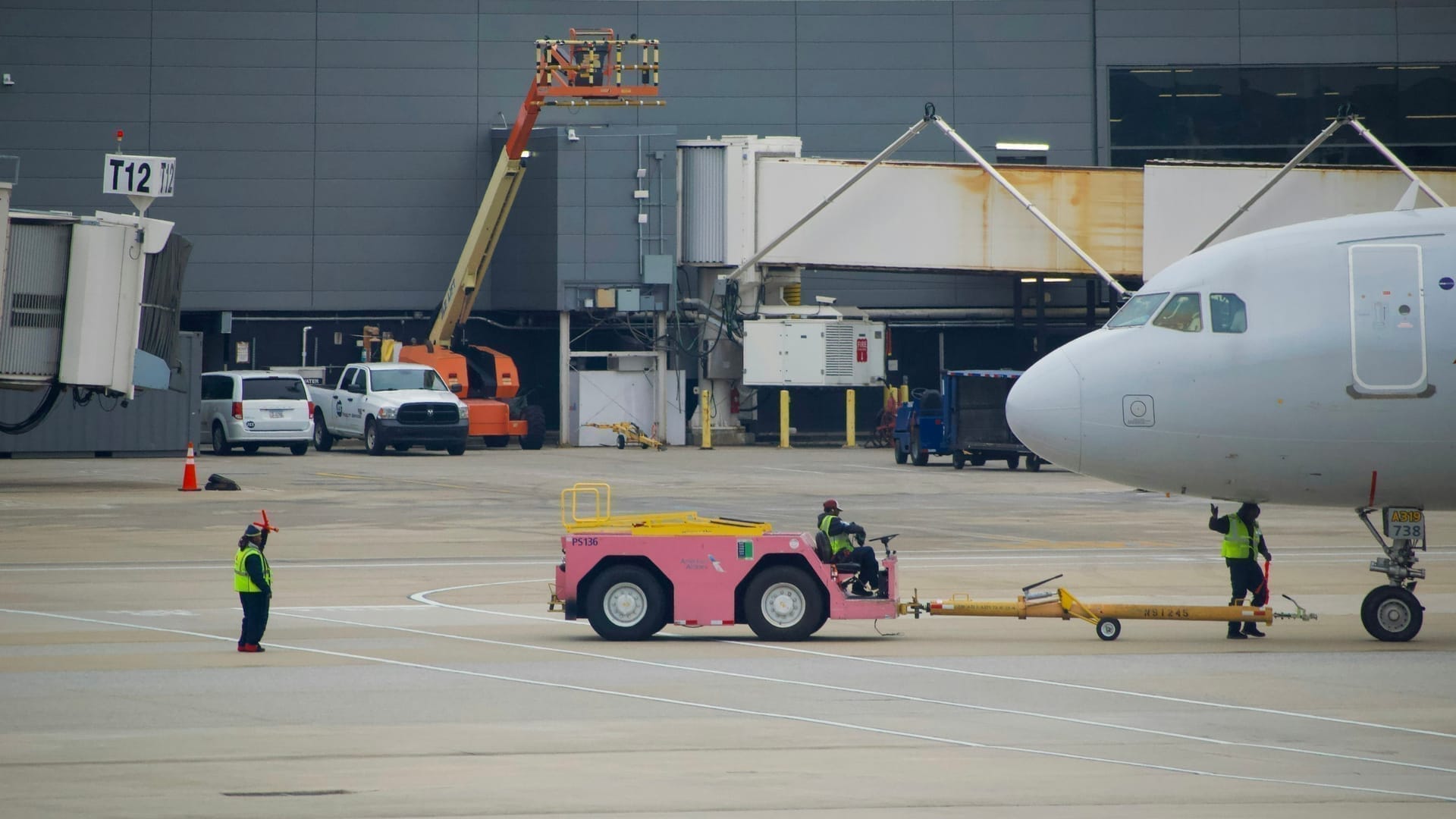 Ground crew coordinating on airport ramp