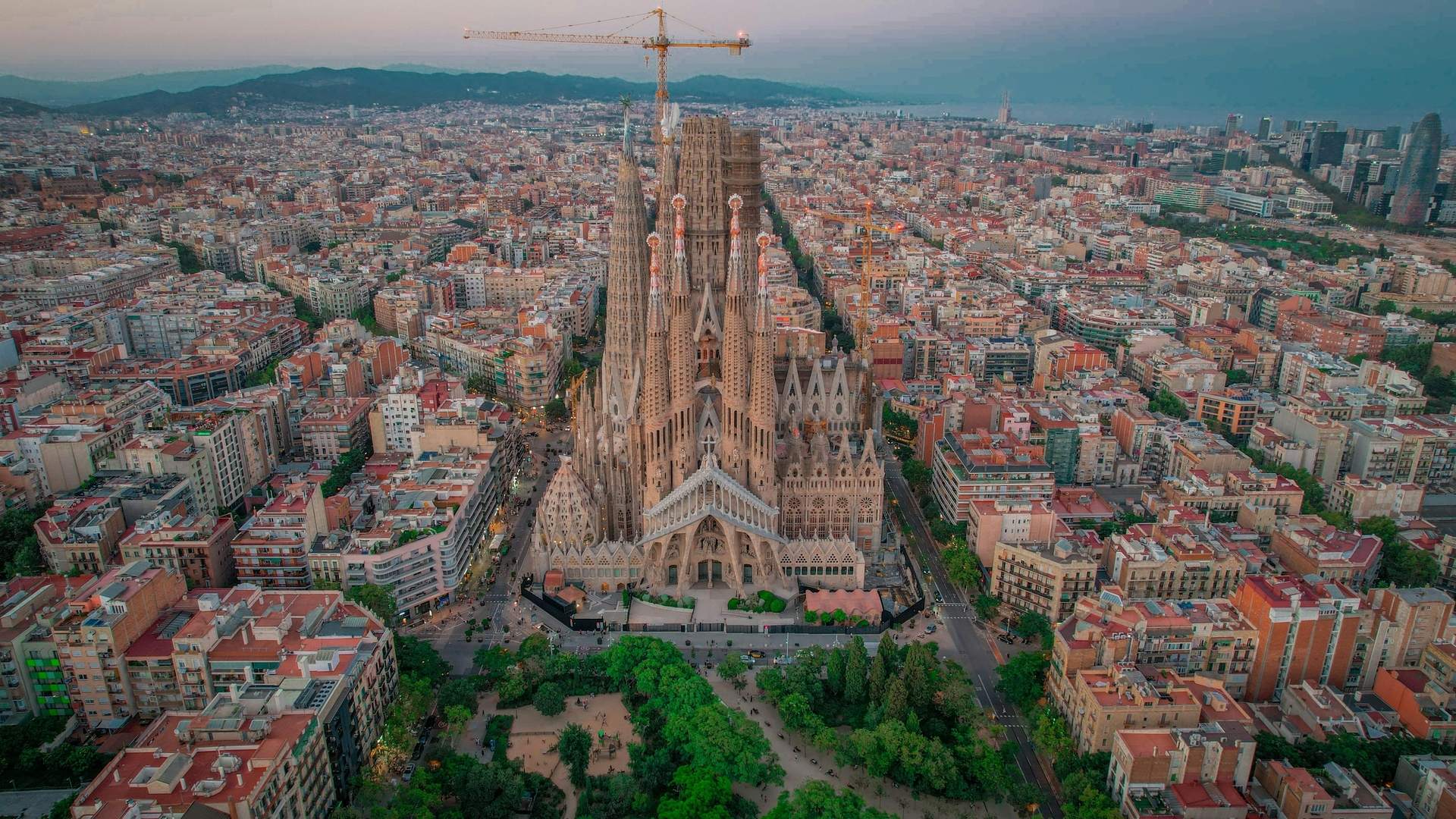 Aerial view of La Sagrada Familia in Barcelona with cityscape