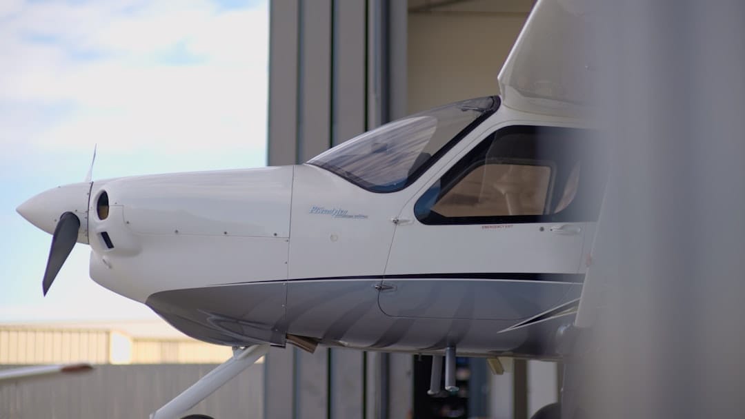 Private jet parked inside a hangar