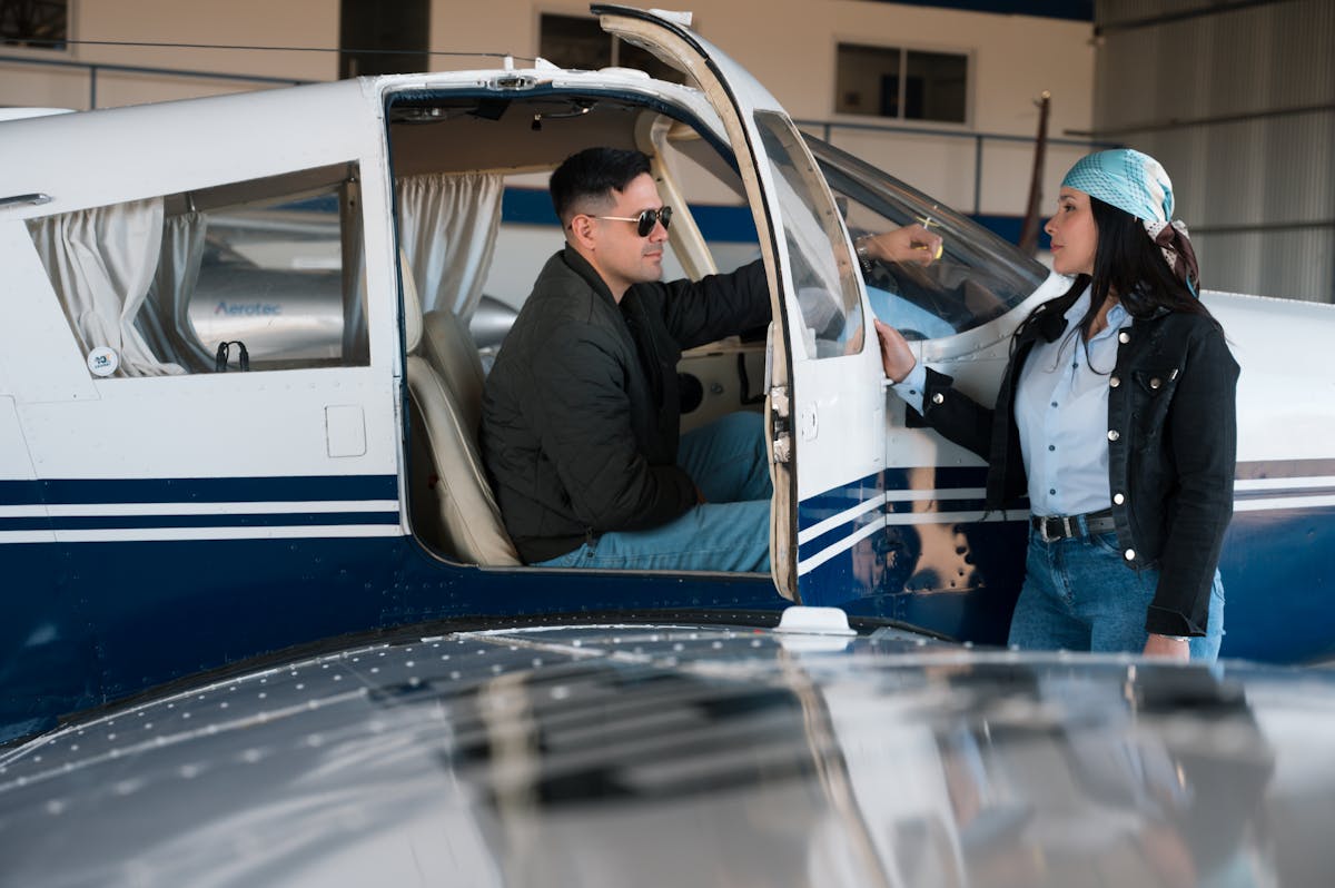 Small plane parked in hangar